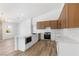 Bright kitchen featuring stainless steel appliances, quartz countertops, and modern lighting at 8032 Deep Stone Ave, Las Vegas, NV 89149