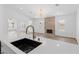 Modern kitchen with a sink and quartz countertops at 8032 Deep Stone Ave, Las Vegas, NV 89149