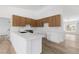 Modern kitchen with white countertops, stainless steel appliances, and wooden cabinets at 8032 Deep Stone Ave, Las Vegas, NV 89149