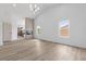 Bright, open living room with modern finishes, tile flooring, and fireplace feature at 8032 Deep Stone Ave, Las Vegas, NV 89149