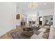 Spacious living area with modern furnishings, hardwood floors, and an open floor plan at 8032 Deep Stone Ave, Las Vegas, NV 89149