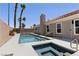 A stunning backyard featuring a pool and spa, perfect for relaxation and outdoor enjoyment at 8032 Deep Stone Ave, Las Vegas, NV 89149