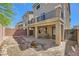 Backyard featuring desert landscaping, a fire pit, and covered patio at 8121 Russell Creek Ct, Las Vegas, NV 89139