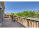 Enjoy neighborhood views from this lovely balcony with stone accents and black metal railing at 8121 Russell Creek Ct, Las Vegas, NV 89139