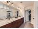 Bathroom featuring double sinks, a long vanity, and tile floors at 8121 Russell Creek Ct, Las Vegas, NV 89139