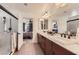 Bathroom featuring double sinks, tile floors, and a walk-in shower at 8121 Russell Creek Ct, Las Vegas, NV 89139