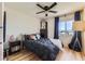 Bedroom featuring a ceiling fan, hardwood floors, and views of the nearby mountains at 8121 Russell Creek Ct, Las Vegas, NV 89139