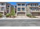 Attractive multi-story home featuring desert landscaping, a two-car garage, and a private balcony at 8121 Russell Creek Ct, Las Vegas, NV 89139