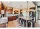 A gourmet kitchen featuring wood cabinets, stainless steel appliances, granite countertops, and a large center island at 8121 Russell Creek Ct, Las Vegas, NV 89139