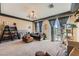 Bright living room with large windows, stylish decor, and a comfortable seating area at 8121 Russell Creek Ct, Las Vegas, NV 89139