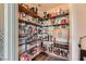 Well-organized pantry with ample storage shelves and compartments for efficient kitchen organization at 8121 Russell Creek Ct, Las Vegas, NV 89139
