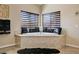 This large tub is framed by two windows with custom shades, providing both light and privacy at 8223 Saddleback Ledge Ave, Las Vegas, NV 89147