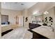 Large bathroom featuring double sinks, a soaking tub, and an archway to the rest of the house at 8223 Saddleback Ledge Ave, Las Vegas, NV 89147