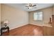 Bedroom with hardwood floors, a ceiling fan, and a bright, airy feel at 8223 Saddleback Ledge Ave, Las Vegas, NV 89147