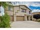Handsome two-story home featuring an attached three-car garage with a long driveway at 8223 Saddleback Ledge Ave, Las Vegas, NV 89147