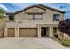 Stunning two-story home with a three-car garage and immaculate front yard landscaping at 8223 Saddleback Ledge Ave, Las Vegas, NV 89147
