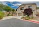 Gorgeous two-story home boasting a three-car garage and beautiful front yard landscaping at 8223 Saddleback Ledge Ave, Las Vegas, NV 89147