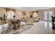 Spacious living room and dining area with tile floors, neutral walls, and ample natural light at 8223 Saddleback Ledge Ave, Las Vegas, NV 89147