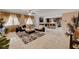 Bright open-concept living room featuring a kitchen, comfortable seating, and stylish decor at 8223 Saddleback Ledge Ave, Las Vegas, NV 89147