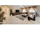 Spacious living room with tile floors, a ceiling fan, and large windows providing ample natural light at 8223 Saddleback Ledge Ave, Las Vegas, NV 89147