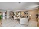 Bright and spacious living room featuring neutral paint, tile floors and classic furnishings at 8223 Saddleback Ledge Ave, Las Vegas, NV 89147