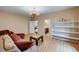Living room featuring a comfortable sofa, open doorway, and lots of light at 8223 Saddleback Ledge Ave, Las Vegas, NV 89147