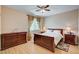 Comfortable bedroom with wood floors, neutral walls, and a coordinating furniture set at 8223 Saddleback Ledge Ave, Las Vegas, NV 89147