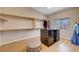 Spacious walk-in closet with custom shelving, center island, and natural light at 8223 Saddleback Ledge Ave, Las Vegas, NV 89147