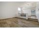 Spacious living area with tile flooring, staircase, and large window providing ample natural light at 827 Happy Sparrow Ave, Henderson, NV 89052