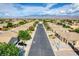 A high-angle street view shows well-maintained homes with desert landscaping at 854 Santa Maria Way, Mesquite, NV 89027