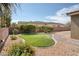 Landscaped backyard with green lawn and patio area, perfect for outdoor relaxation at 854 Santa Maria Way, Mesquite, NV 89027