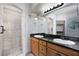 Beautiful bathroom featuring dual sinks, walk-in shower, and ample storage at 854 Santa Maria Way, Mesquite, NV 89027