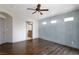 Spacious bedroom with hardwood floors, ceiling fan, and ensuite bathroom at 854 Santa Maria Way, Mesquite, NV 89027