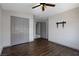 Comfortable bedroom featuring hardwood flooring, ceiling fan, and closet at 854 Santa Maria Way, Mesquite, NV 89027