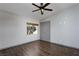 Spacious bedroom with hardwood floors, ceiling fan, and natural light at 854 Santa Maria Way, Mesquite, NV 89027