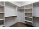 Organized walk-in closet with custom shelving and racks for optimal storage solutions at 854 Santa Maria Way, Mesquite, NV 89027