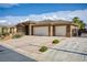 Beautiful home with a two-car garage and lush landscaping at 854 Santa Maria Way, Mesquite, NV 89027