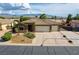 Charming single-story home featuring a three-car garage and a well-maintained front yard at 854 Santa Maria Way, Mesquite, NV 89027
