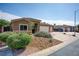 Landscaped front yard with mature bushes and a view of the home's entrance at 854 Santa Maria Way, Mesquite, NV 89027