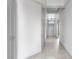 Bright hallway featuring tiled floor, recessed ceiling, and neutral color palette at 854 Santa Maria Way, Mesquite, NV 89027