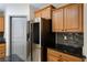 Gourmet kitchen featuring a stainless steel refrigerator and granite countertops at 854 Santa Maria Way, Mesquite, NV 89027