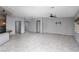 Open living room with tile floors and access to the kitchen and other areas of the home at 854 Santa Maria Way, Mesquite, NV 89027