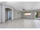 Spacious living room with tile flooring, ceiling fan, and access to the backyard at 854 Santa Maria Way, Mesquite, NV 89027