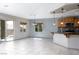 Open-concept living area with tile flooring, neutral paint, and ample natural light at 854 Santa Maria Way, Mesquite, NV 89027
