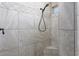 Shower stall with tan tile, decorative trim and an adjustable shower head at 854 Santa Maria Way, Mesquite, NV 89027
