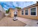 Backyard view with patio, gravel landscaping and ample natural light at 8560 Osmerea Ct, Las Vegas, NV 89149
