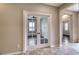 Elegant entryway with tile flooring and French doors leading to a living space at 8560 Osmerea Ct, Las Vegas, NV 89149