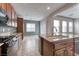 Open kitchen featuring granite countertops, stainless steel appliances, and natural light at 8560 Osmerea Ct, Las Vegas, NV 89149