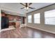 Open floor plan featuring wood flooring, kitchen island, and bright sunny windows at 8560 Osmerea Ct, Las Vegas, NV 89149
