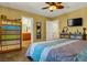 Cozy bedroom featuring a colorful dresser and views into the ensuite bathroom at 9236 Keystone Ridge Ave, Las Vegas, NV 89148